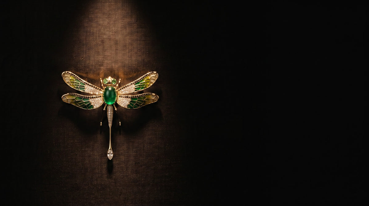 A METALIKA STUDIO brass brooch pinned to a silk panel
